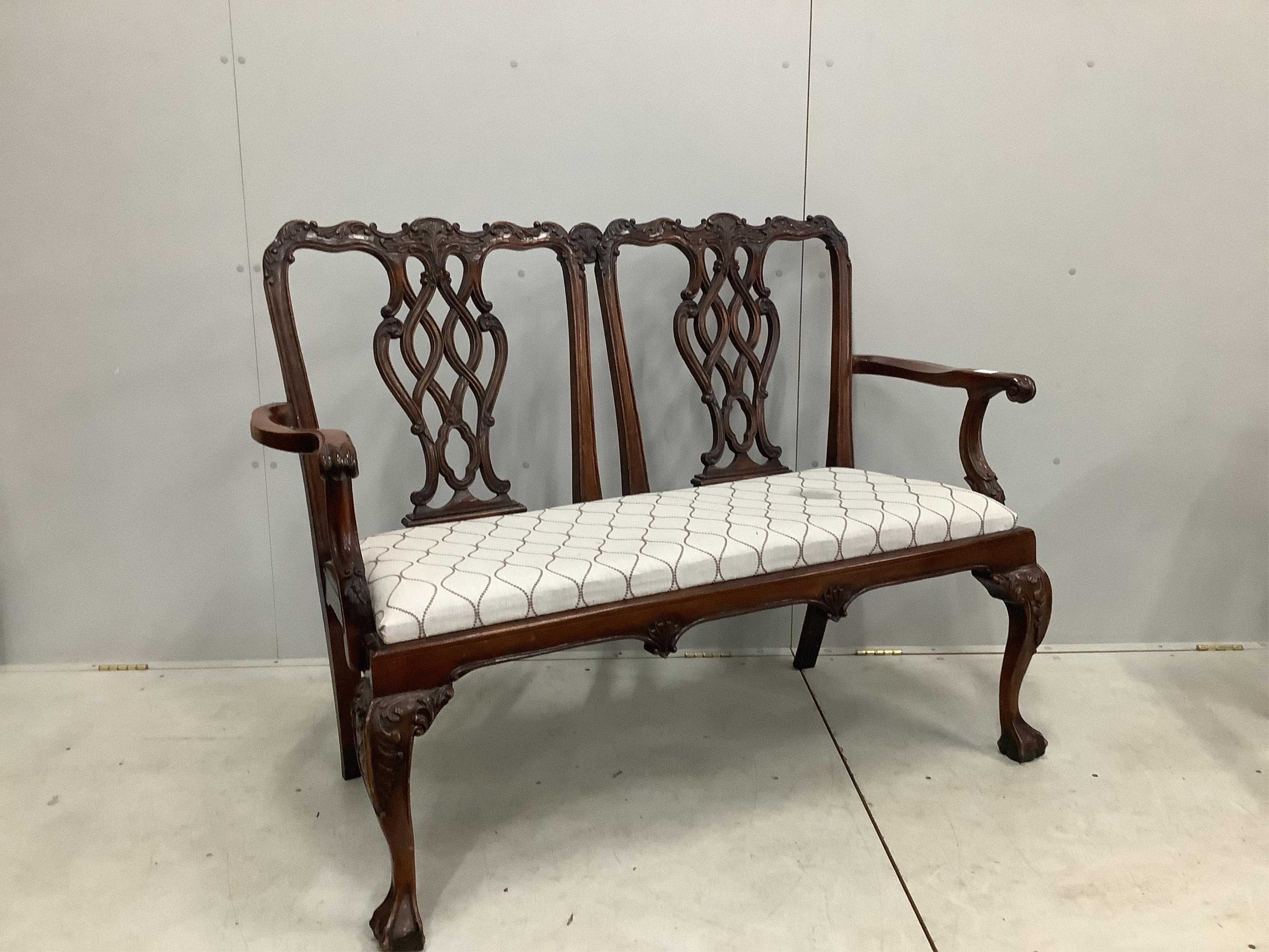 A Chippendale Revival mahogany chair back settee, width 137cm, height 103cm. Condition - good but for a stain on the fabric of the seat